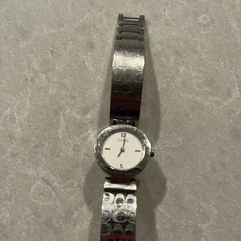 Coach silver watch bracelet style. Good condition